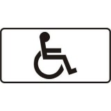 Tabliczka T-29 Miejsce dla pojazdu osoby niepełnosprawnej. Tabliczka informująca o miejscu przeznaczonym dla pojazdu samochodowego uprawnionej osoby niepełnosprawnej o obniżonej sprawności ruchowej